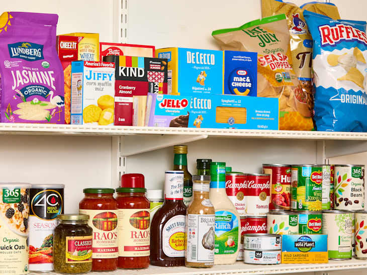 Recognizable branded groceries arranged on pantry shelves