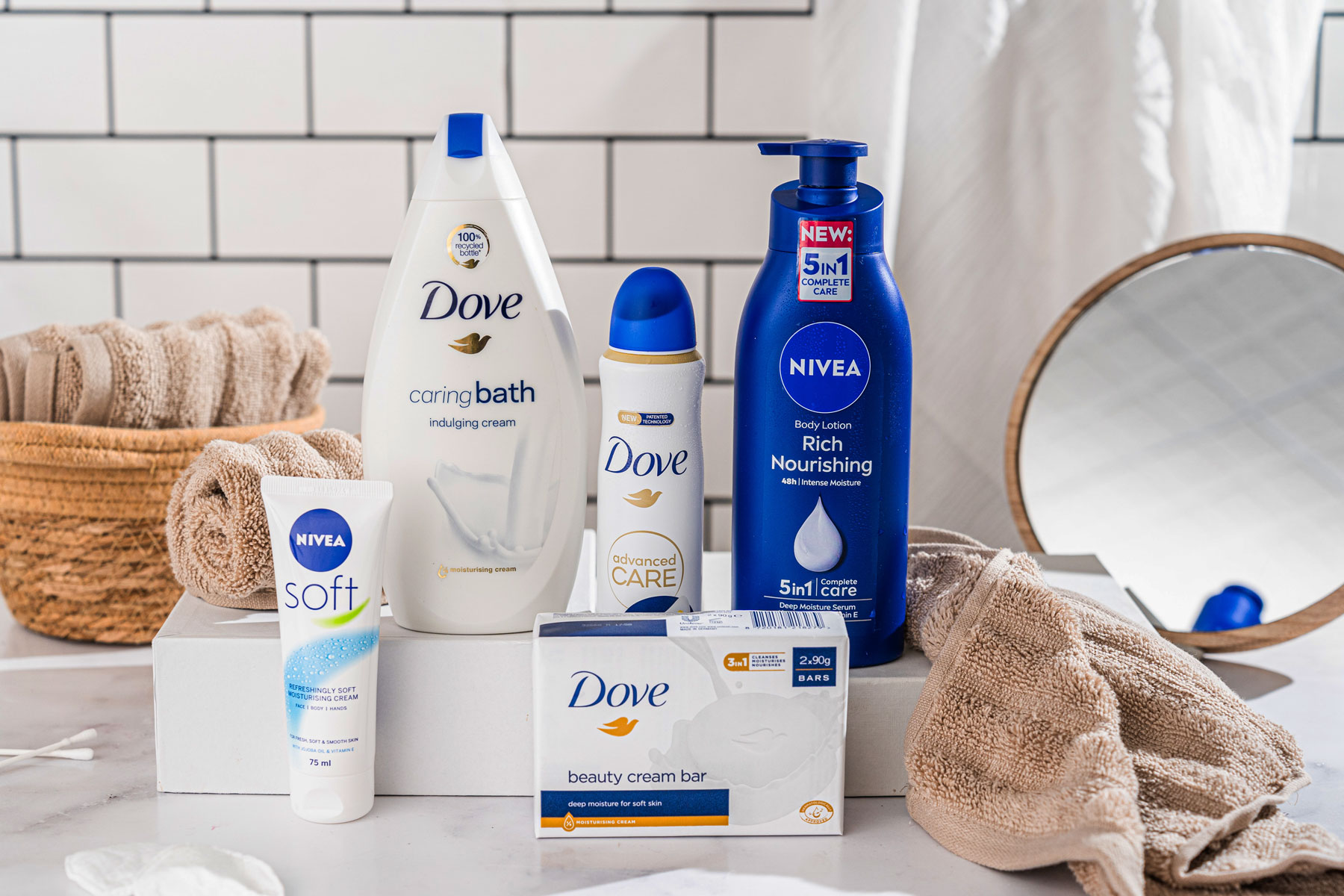 Dove and Nivea personal care products on a bathroom counter